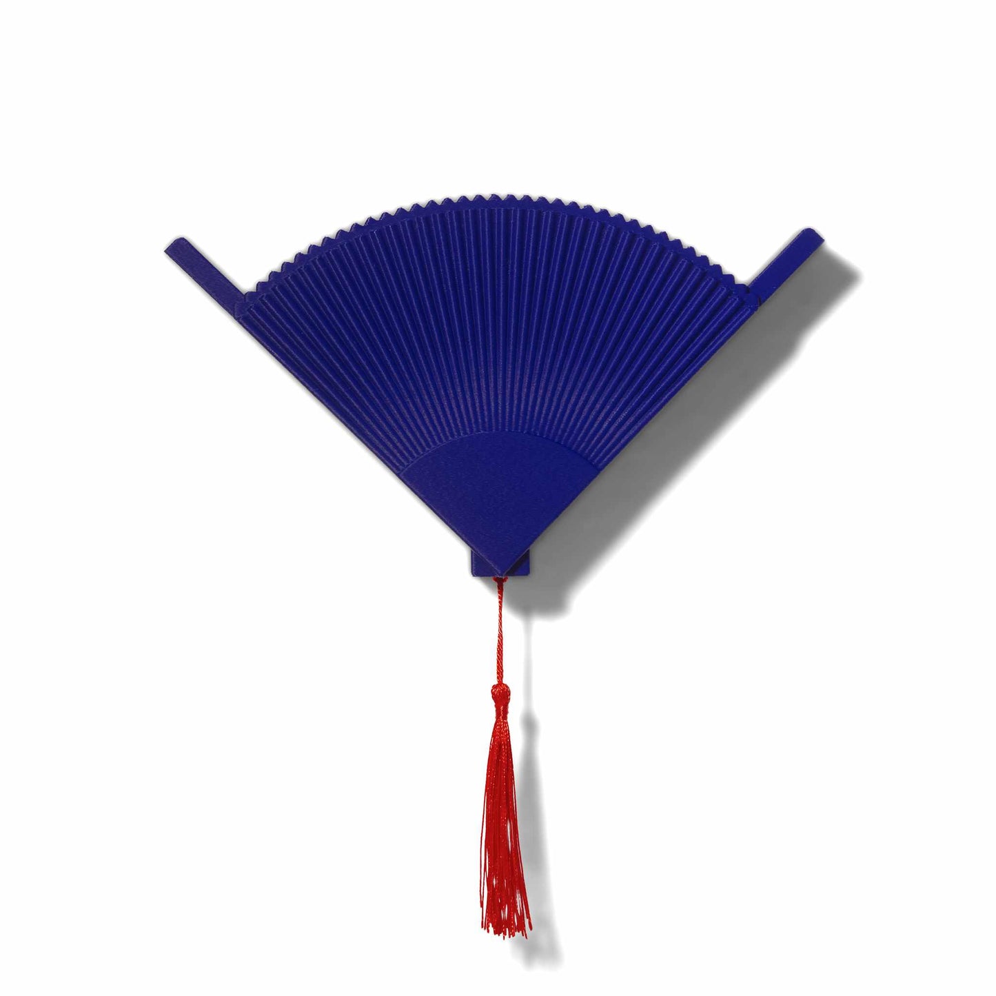 Blue coffee filter holder with a red tassel on a white background