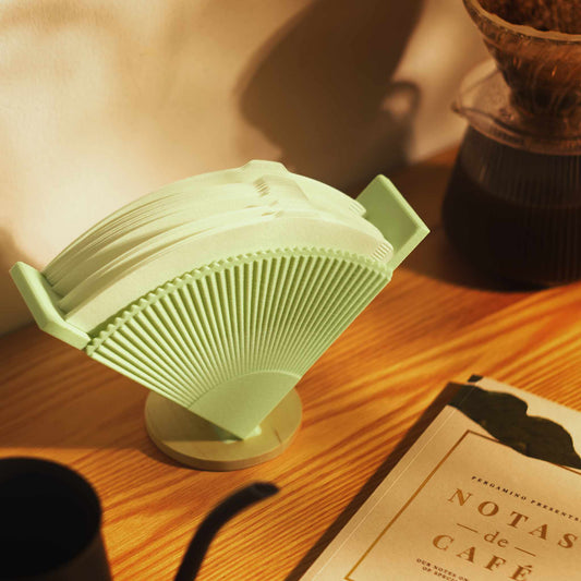 mint green coffee filter stand displayed on a table
