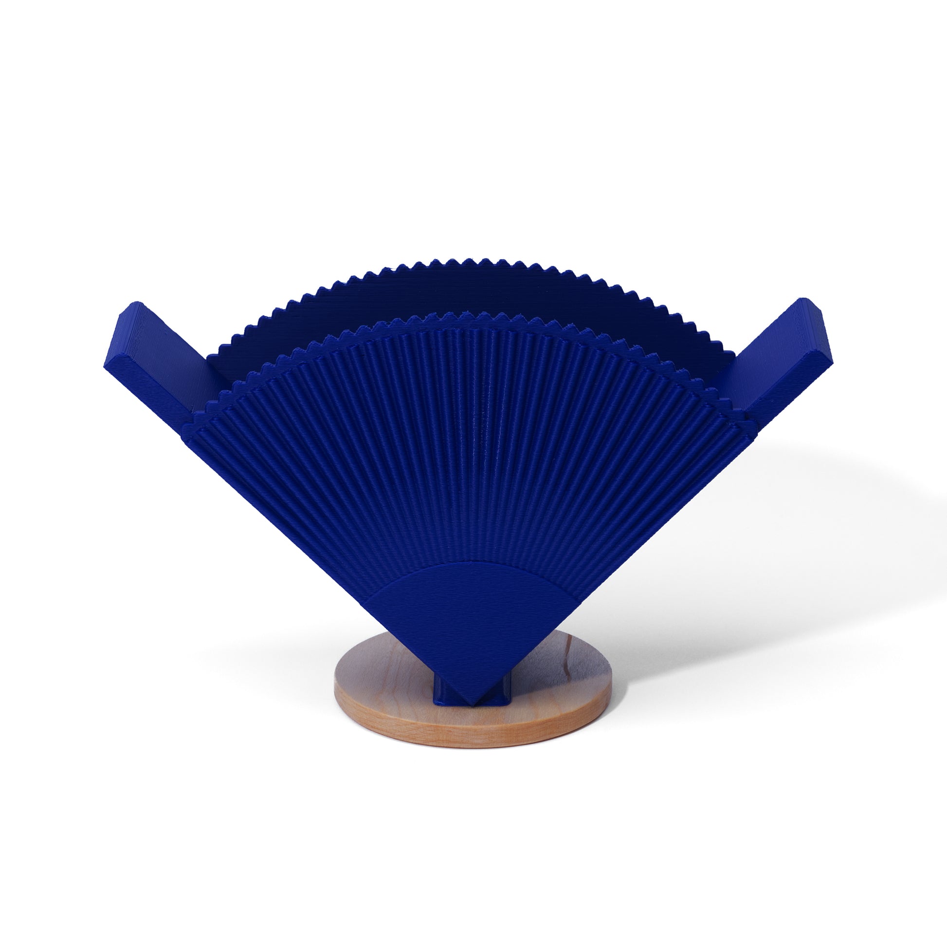 Blue coffee filter holder with a wooden base on a white background