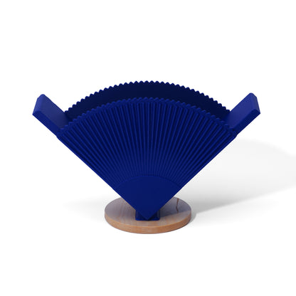 Blue coffee filter holder with a wooden base on a white background