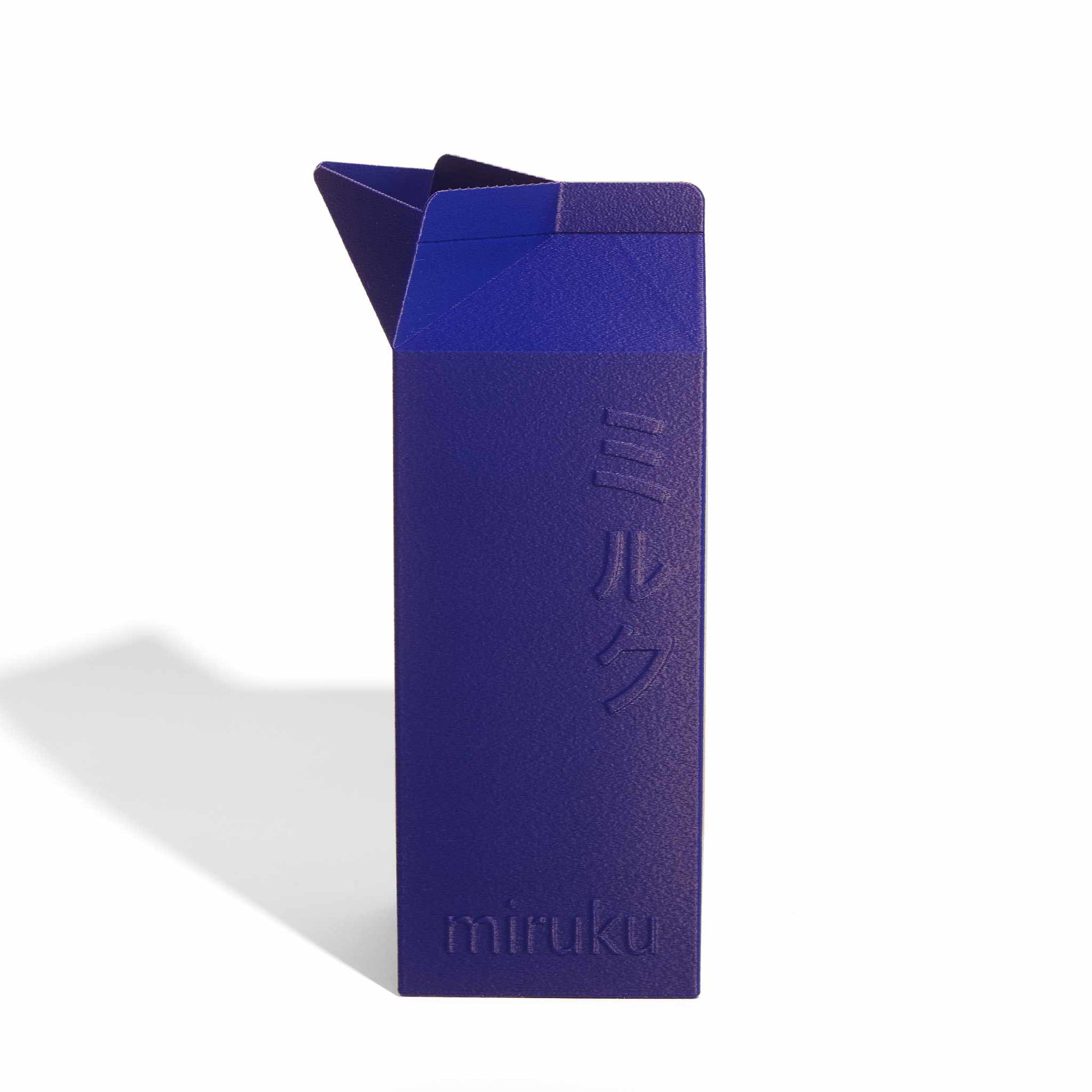 Blue 2L milk carton vase on a white background