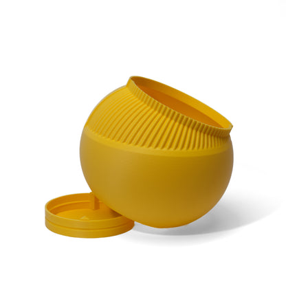 A yellow 3D printed planter pot with a ribbed exterior and its drainage tray   displayed on a white background